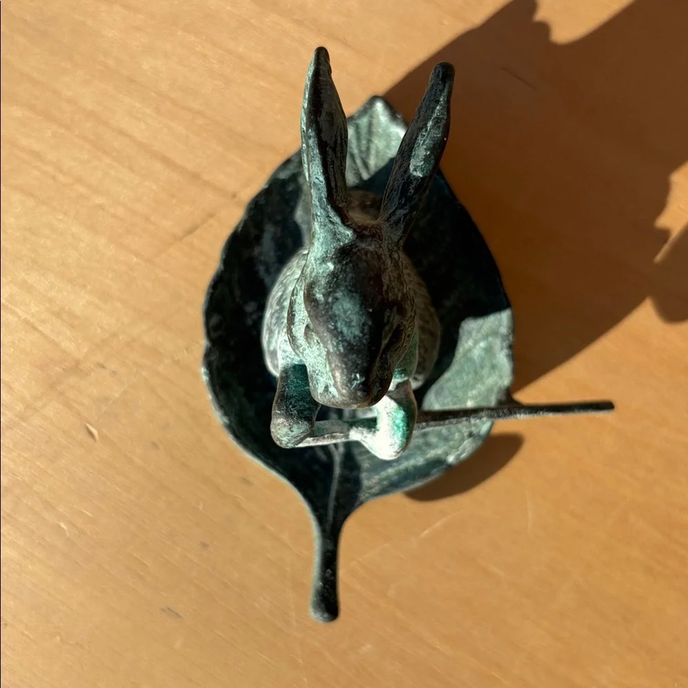 Vintage Bronze Rabbit Paddling A Leaf Boat